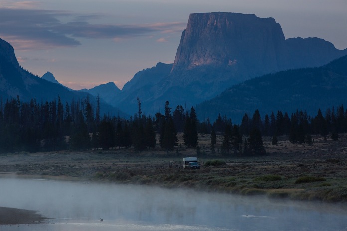Squaretop and the Green River at dawn with a camper trailer